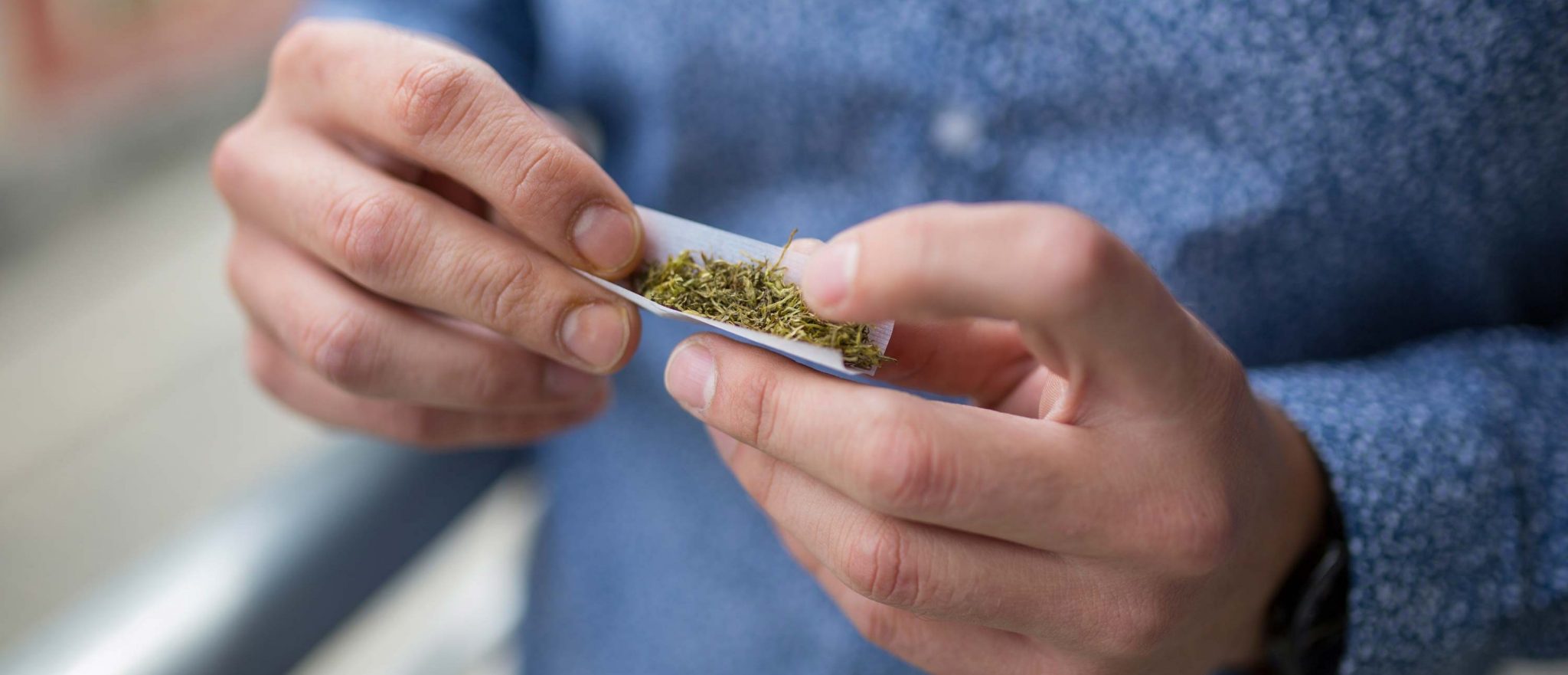Reasons Why Teens Use Drugs: Picture of Teen rolling a joint