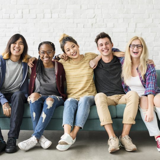 Teens sitting on a couch after group therapy